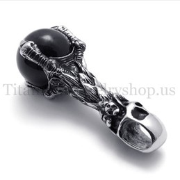 skull holding a black gem pure titanium pendant 20081
